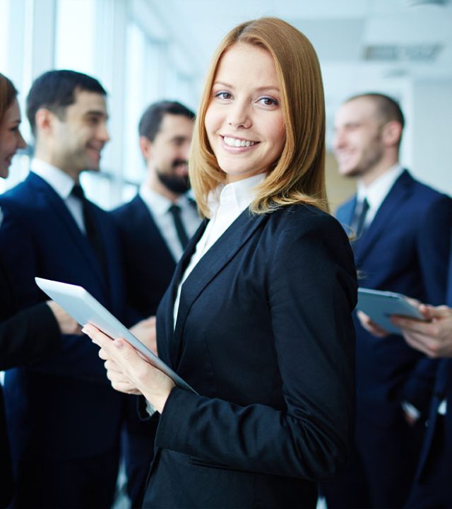 young-entrepreneur-with-co-workers-background